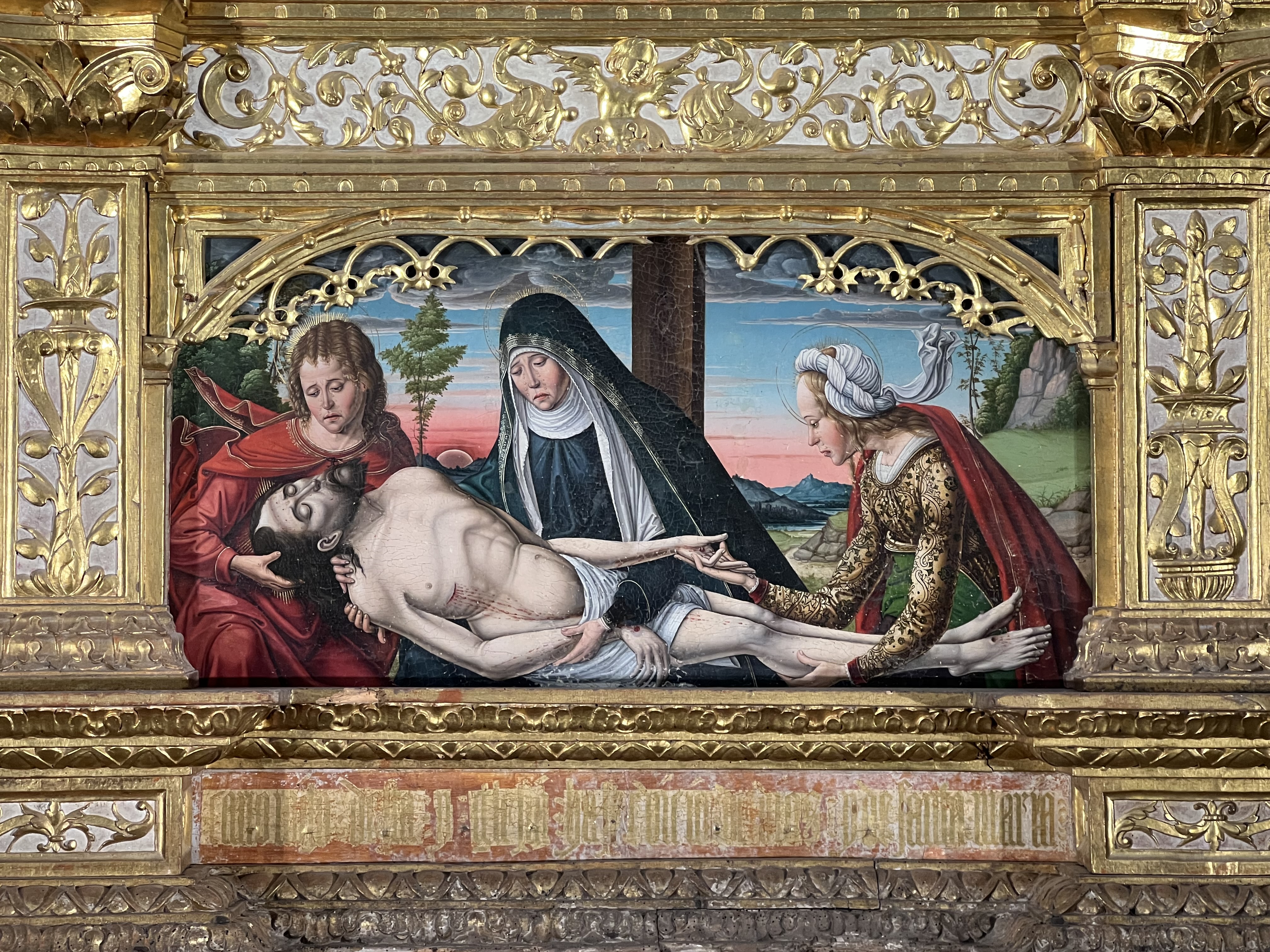 En kyrkomålning där tre kvinnor håller i Jesus döda kropp.