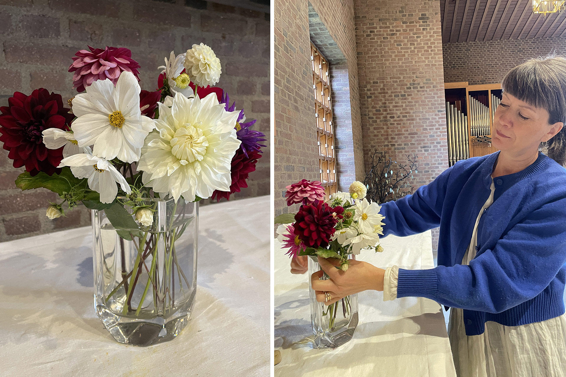 En bukett med blommor i färgerna vitt, rosa och lila står på ett altare i en kyrka. En person håller på att ordna med buketten.